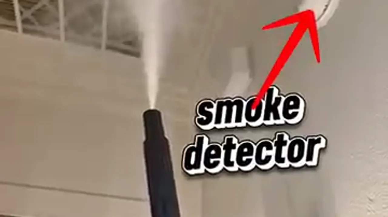 Corrugated flexible gas connector running into a residential furnace cabinet, contact point visible on cabinet edge
